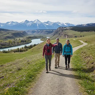 Scenic view of a sun-drenched hiking trail in Calgary with distant mountains and clear skies.