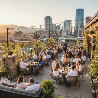 Calgary skyline views from a restaurant patio with people dining and enjoying sunny weather.